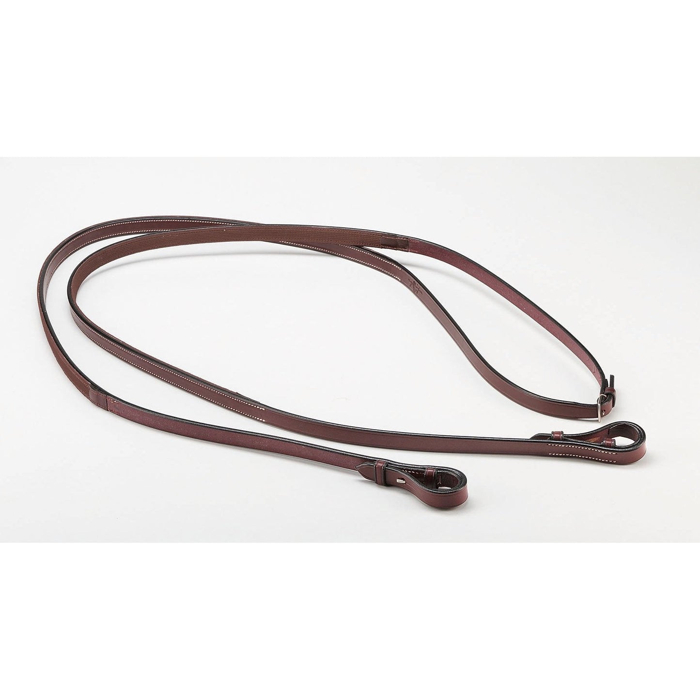 Brown leather horse riding reins on a plain background.