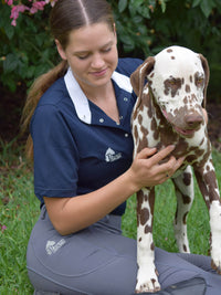 Woman with Dalmatian wearing show shirt undone casual 