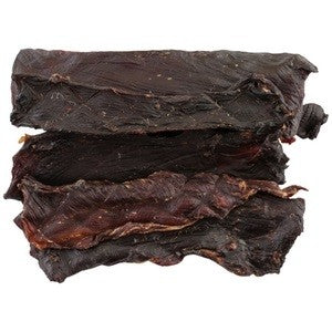 Stack of dried kangaroo dog treats on a white background.