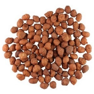 A pile of brown, round kangaroo dog treats on white background.