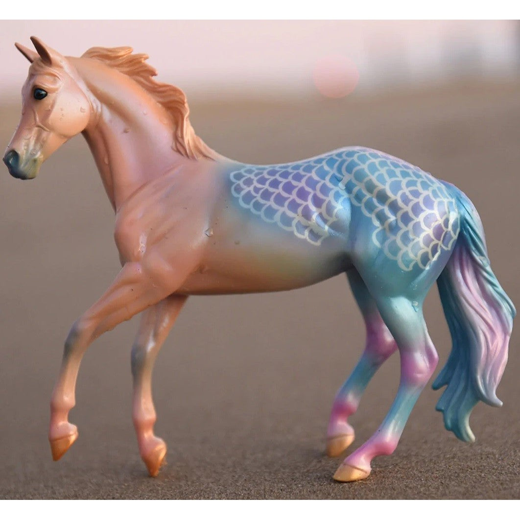 Breyer Horse Toy with gradient color and mermaid scale details.