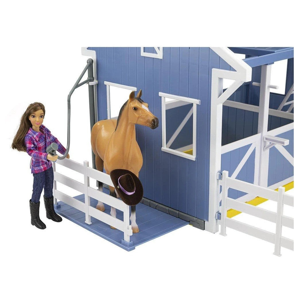 Breyer Horse Toys stable set with doll and horse figure.