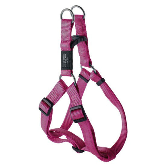 Rogz brand pink dog harness on white background.