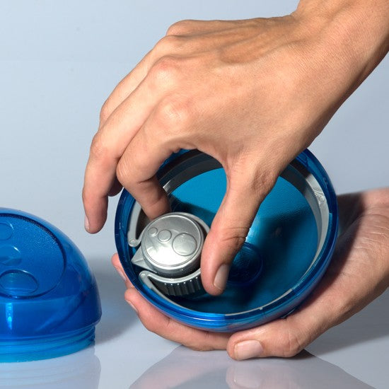 Hands opening a blue Rogz pet food bowl.